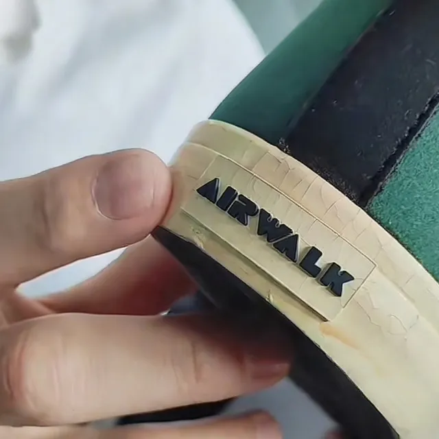 Severe surface cracking on PU shoe sole after demolding.