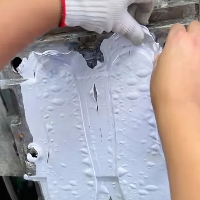 PU shoe sole stuck in mold due to ineffective release agent, showing severe adhesion and incomplete demolding